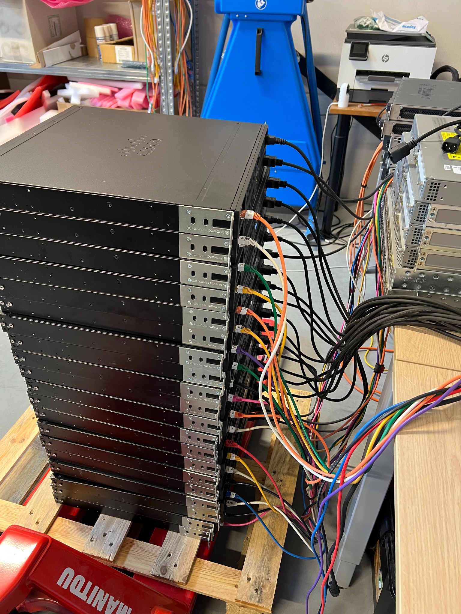 High-volume stack of networking devices connected for automated testing