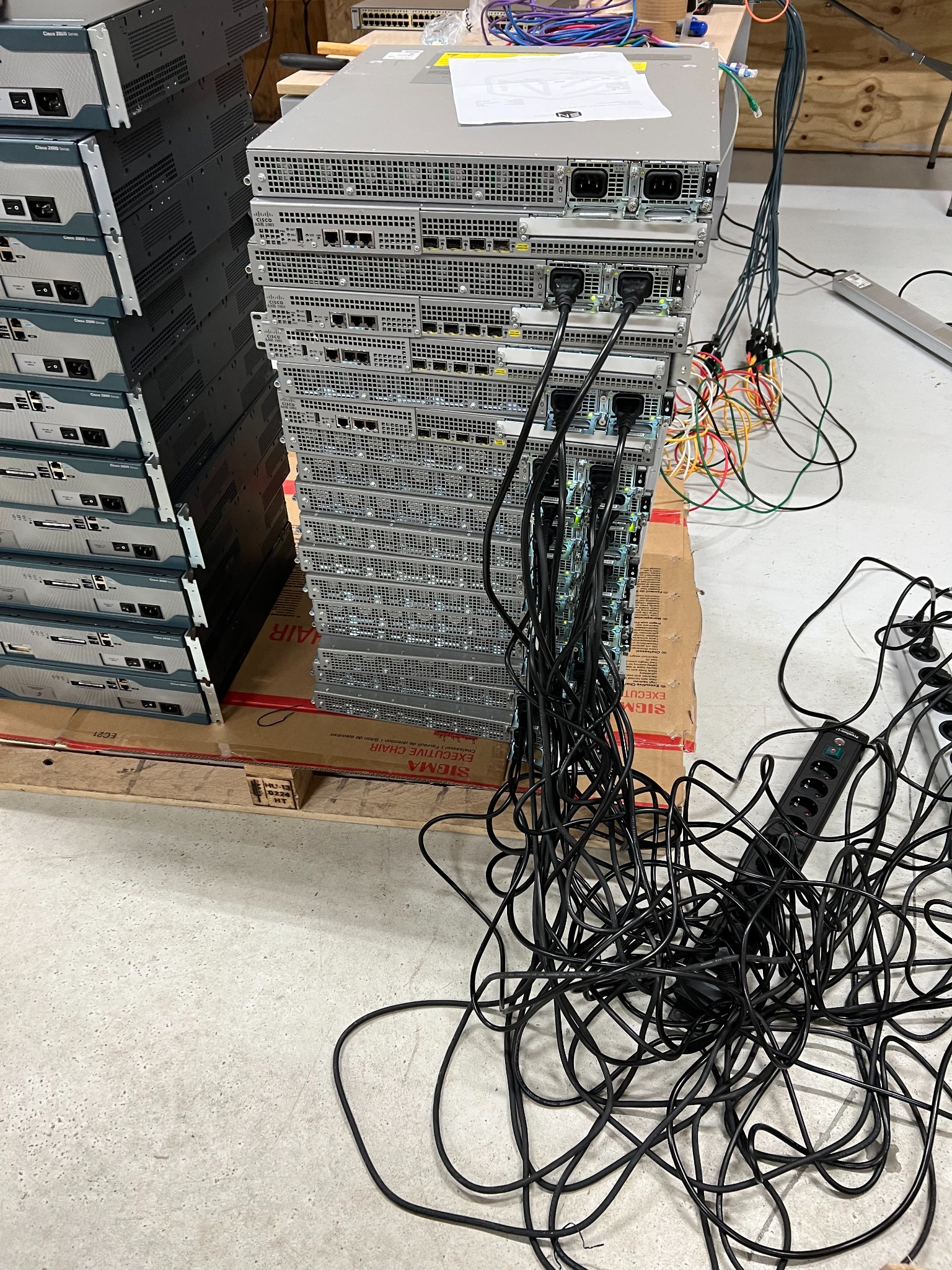 Multiple networking devices connected with power cables during reset workflow